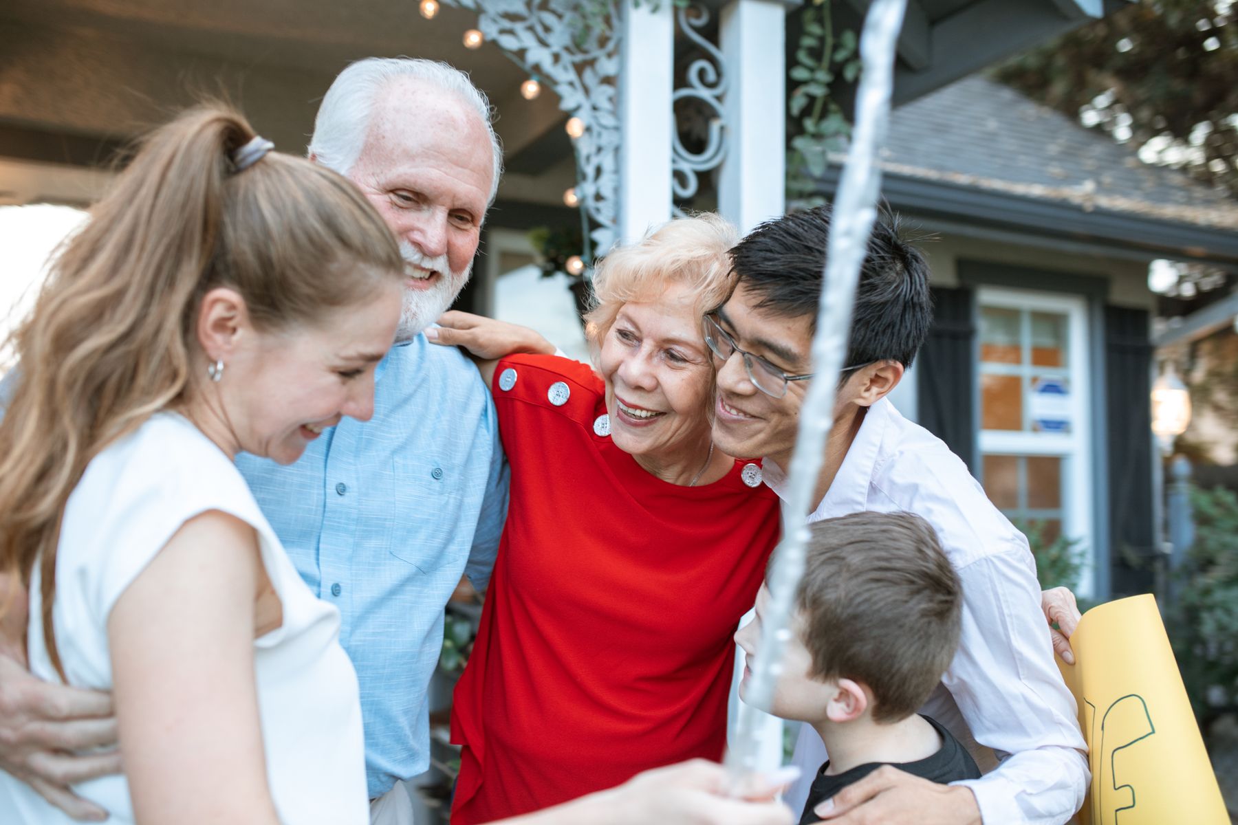A multigenerational family sharing a moment together outdoors